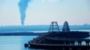 UKRAINE – A fire at an oil depot near the Crimean bridge in the village of Volna in the Krasnodar region of Russia is visible from the territory of the occupied Crimea across the Kerch Strait, May 3, 2023