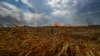 UKRAINE – A burning wheat field is seen near a frontline on a border between Zaporizhzhia and Donetsk regions, as Russia’s attack on Ukraine continues, July 17, 2022