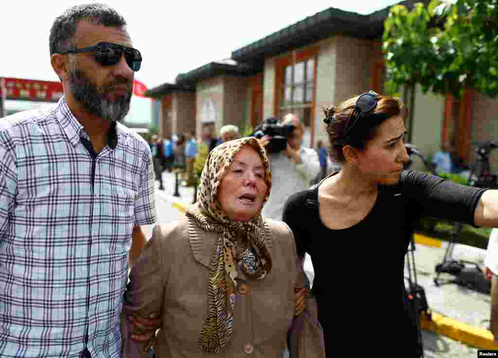 Sacide Bugda (center), mother of Abdulhekim Bugda, who was one of the victims of the attacks, is comforted by relatives at a morgue in Istanbul. (Reuters/Osman Orsal)