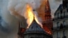 FRANCE -- Smoke and flames rise during a fire at the landmark Notre-Dame Cathedral in central Paris, April 15, 2019