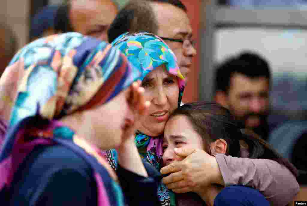 Relatives of the victims mourn in front of a morgue in Istanbul.